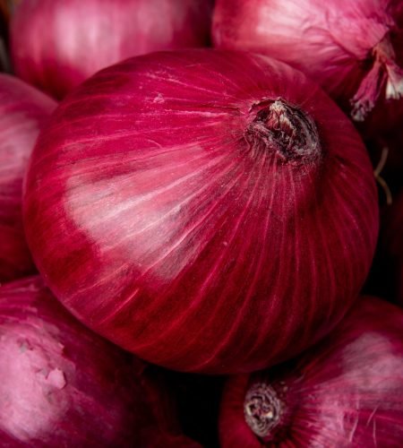close up view of whole red onions